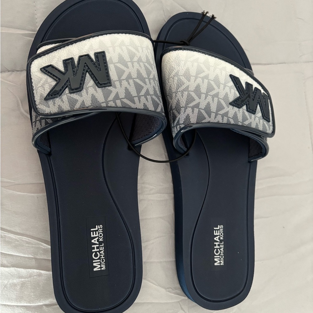 This is the final price.
Michael Kors Navy and White Slide Sandals